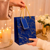 Premium BLUE Glitter Gift Bag 23×18×10 cm | Metallic Paper Gift Bag with Gold Foiling Design, Rope Handle & Tag | Reusable Luxury Gift Bag for Birthday, Wedding, Anniversary & Festive Gifting