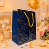 Premium BLUE Metallic Gift Bag 23×18×10 cm | Luxury Paper Gift Bag with Gold Foiling Marble Design, Rope Handle & Gift Tag | Reusable Gift Packaging for Birthday, Wedding, Anniversary, Return Gift, Baby Shower, Corporate & Festive Gifting